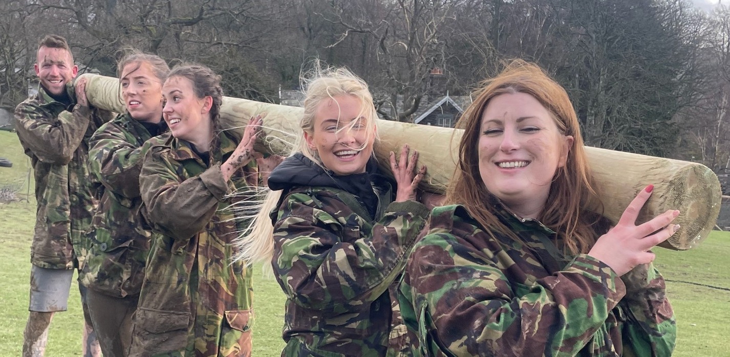 Group carrying a tree trunk