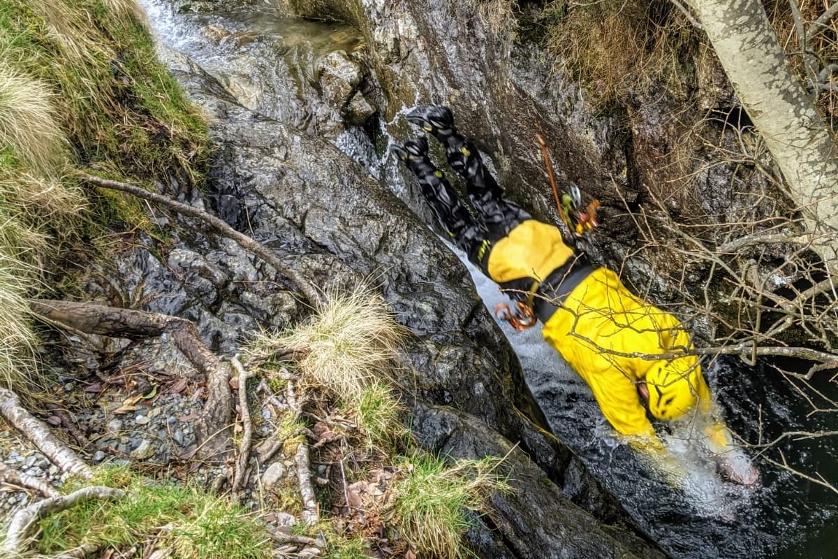Person diving into the water at Stoneycroft Ghyll near Keswick