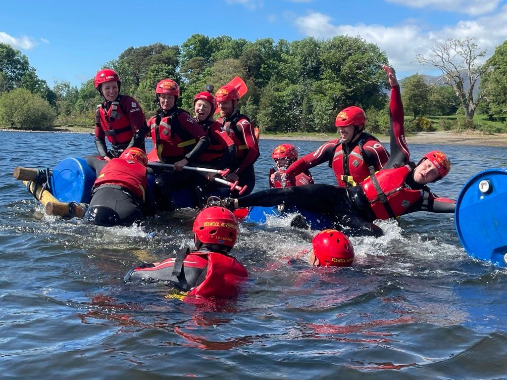 Group raft building on Derwentwater in summer