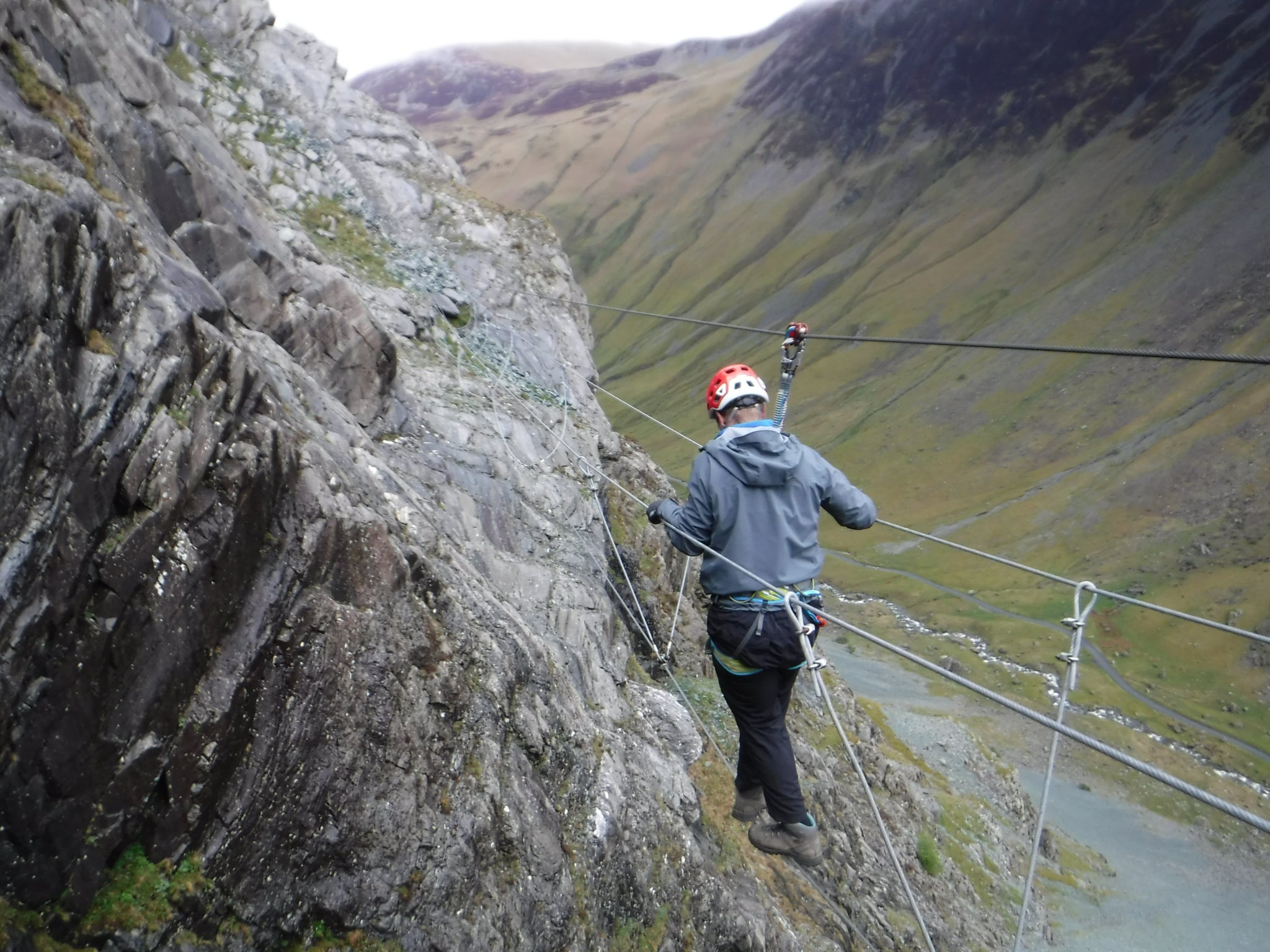 Man on rope bridge on the Via Ferrata at Honister Slate Mine