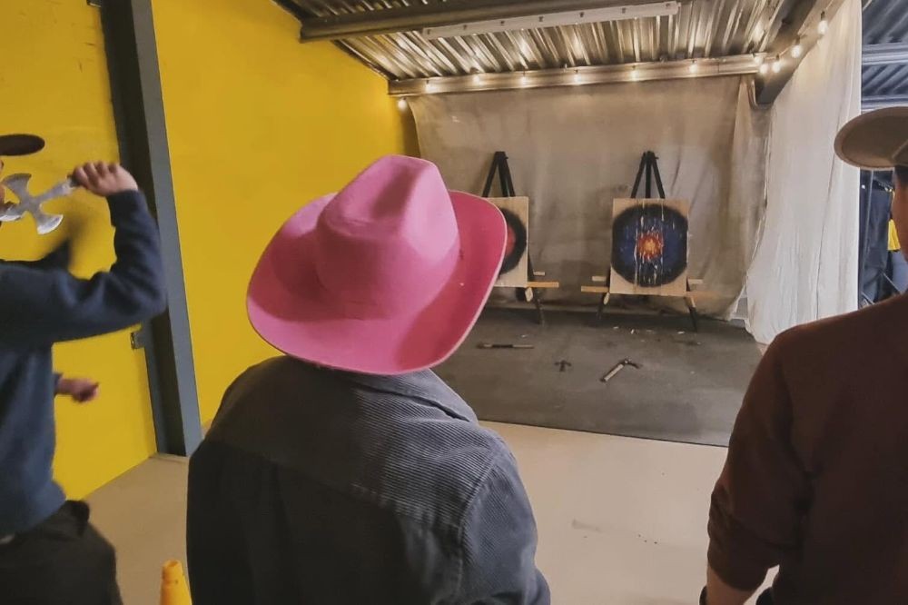 Stag group doing axe throwing